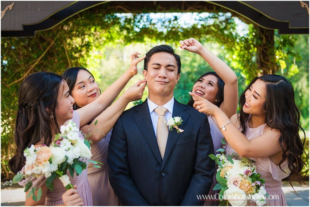 Fun photo of groom with Bridesmaid