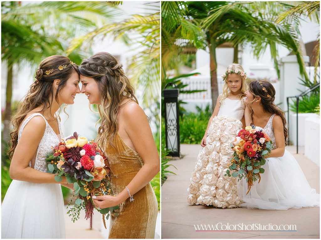 Bride posing with her maid of honor and flower girl