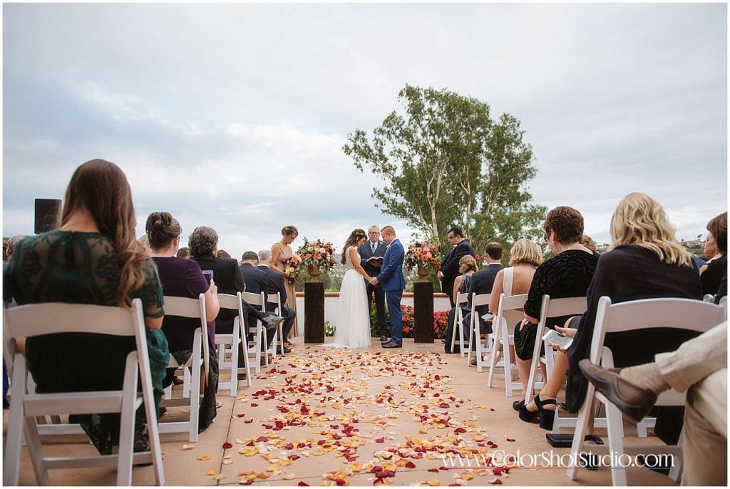 Bride and groom at the ceremony Omni la costa resort wedding photography by color shot studio