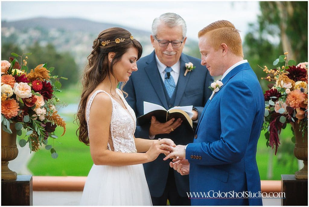 Bride and groom ring exchange during wedding ceremony