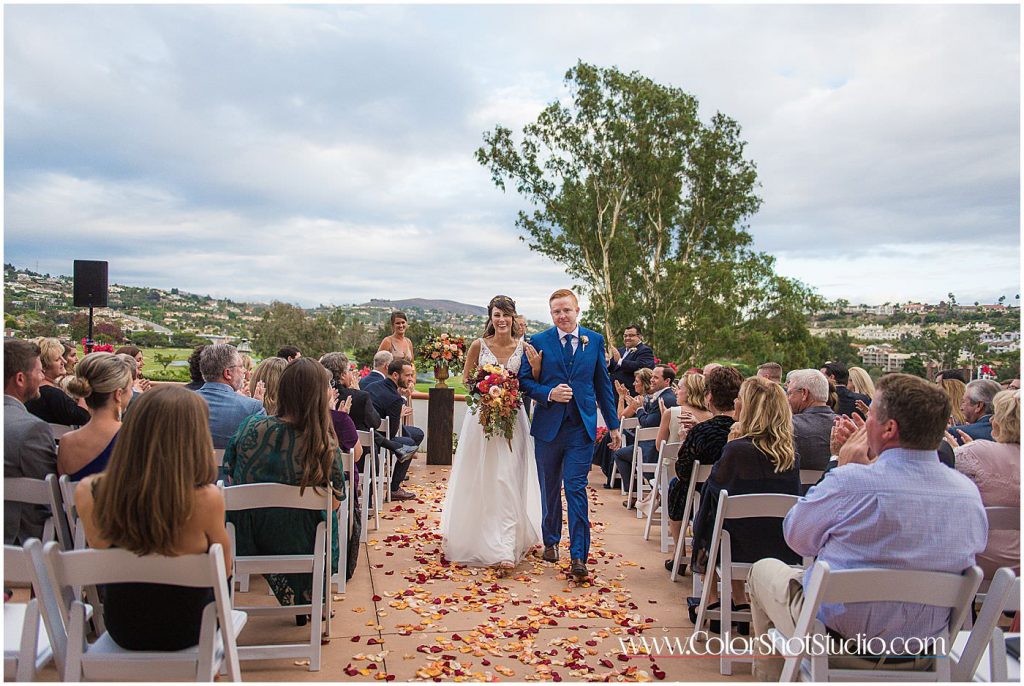 Bride and groom walking together as husband and wife