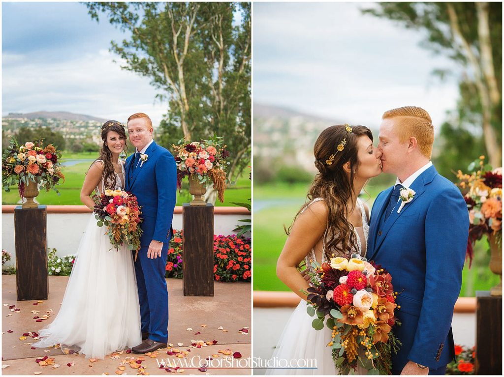 Bride and groom posing near the altar