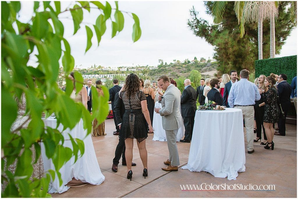 Wedding guests during cocktail hour Omni la costa resort wedding photography by color shot studio
