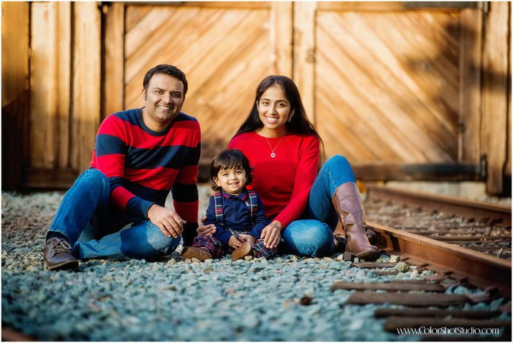 family of three posing together