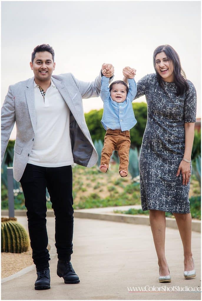 mom dad with their little one