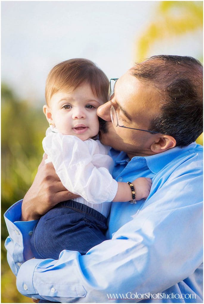 father kissing his daughter